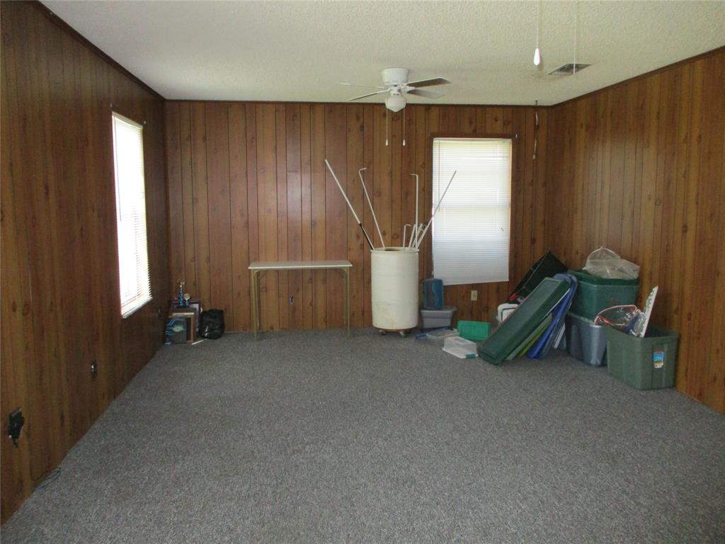 310 County Road 1495 Emory, TX 75440 - Photo 12 of 24 an empty room with windows