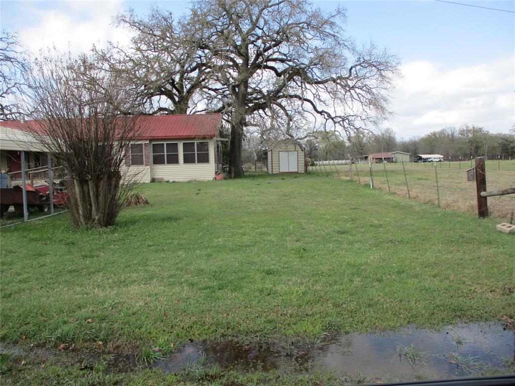 310 County Road 1495 Emory, TX 75440 - Photo 2 of 24 a view of a house with a backyard