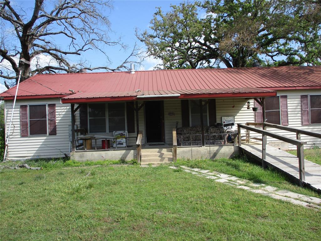 310 County Road 1495 Emory, TX 75440 - Photo 4 of 24 a view of a house with a yard and sitting area