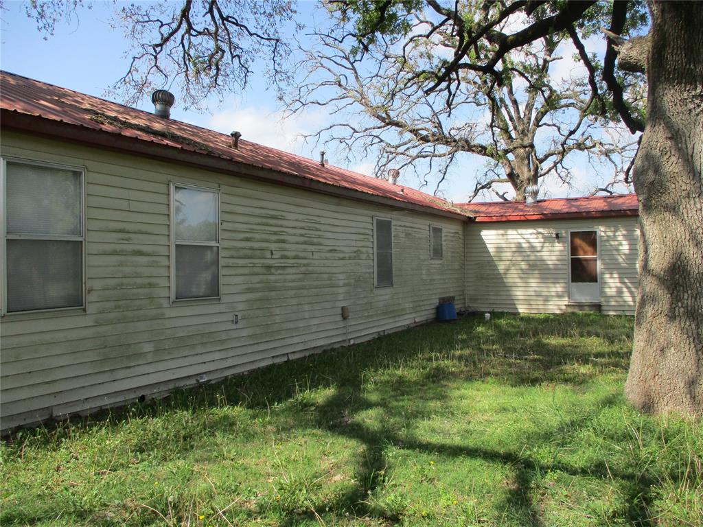 310 County Road 1495 Emory, TX 75440 - Photo 10 of 24 a backyard of a house with lots of green space