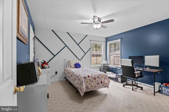 a bedroom with bed and window