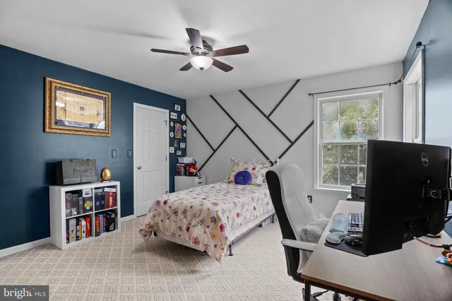 a bedroom with furniture window and white bed