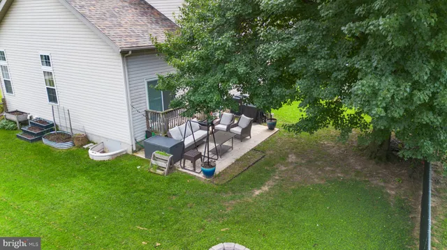 a view of a backyard with a bench