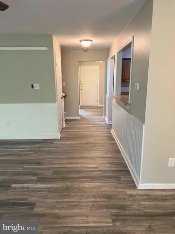 a view of a hallway view with wooden floor