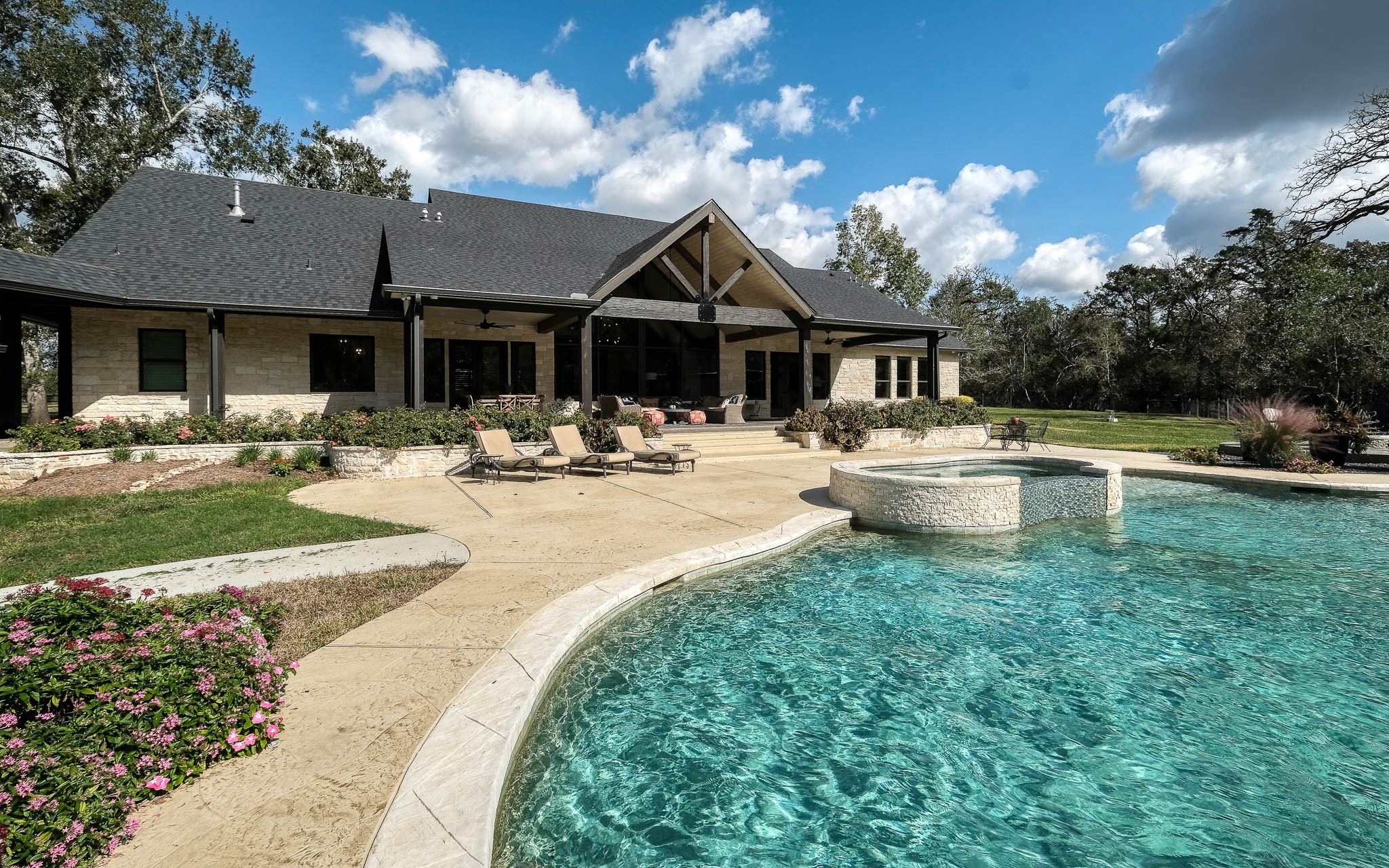 22474 Kmiec Road Hempstead, TX 77445 - Photo 30 of 49 a swimming pool with outdoor seating and yard