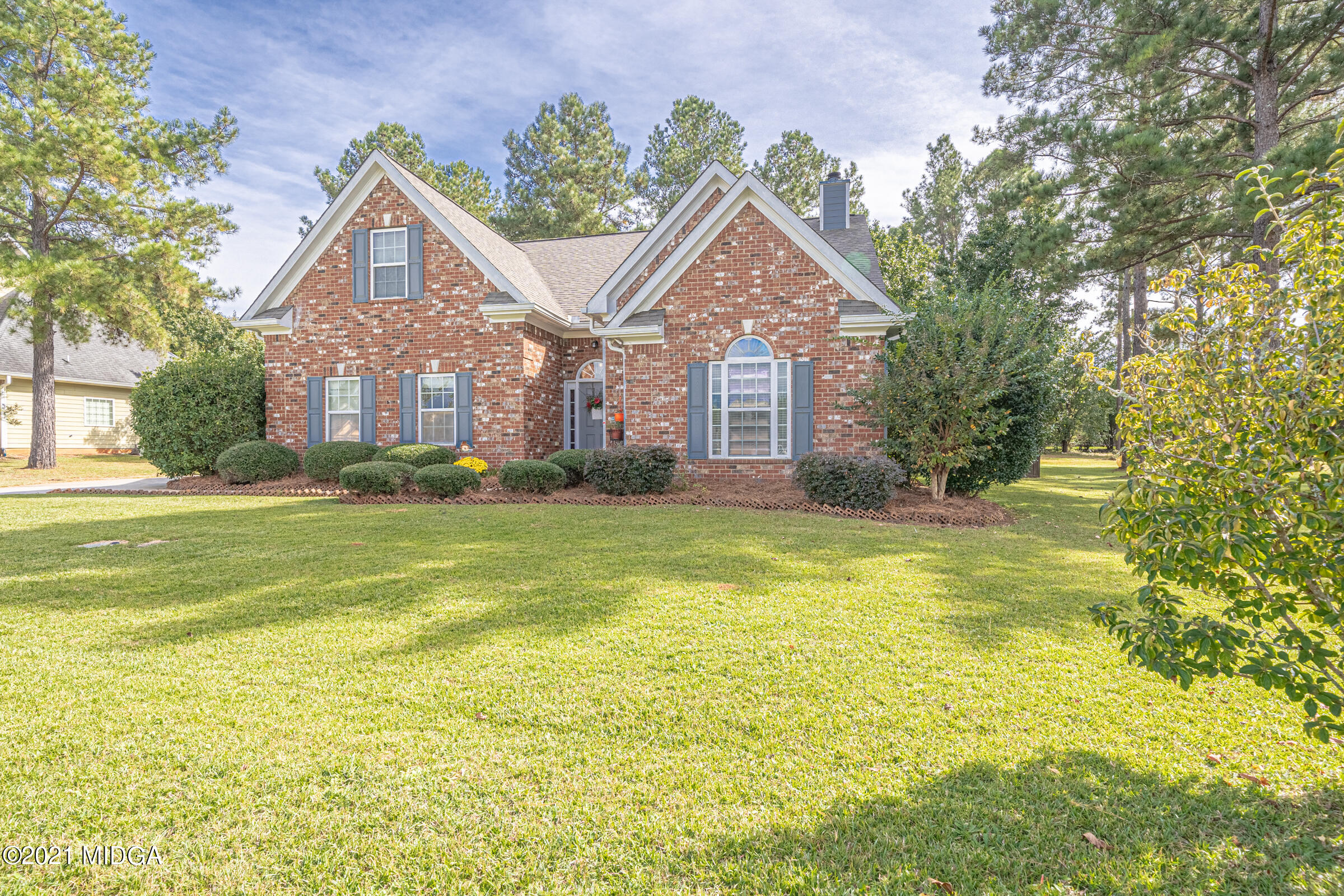 102 Bridgehampton Way Perry, GA 31069 - Photo 2 of 27 a front view of a house with a yard
