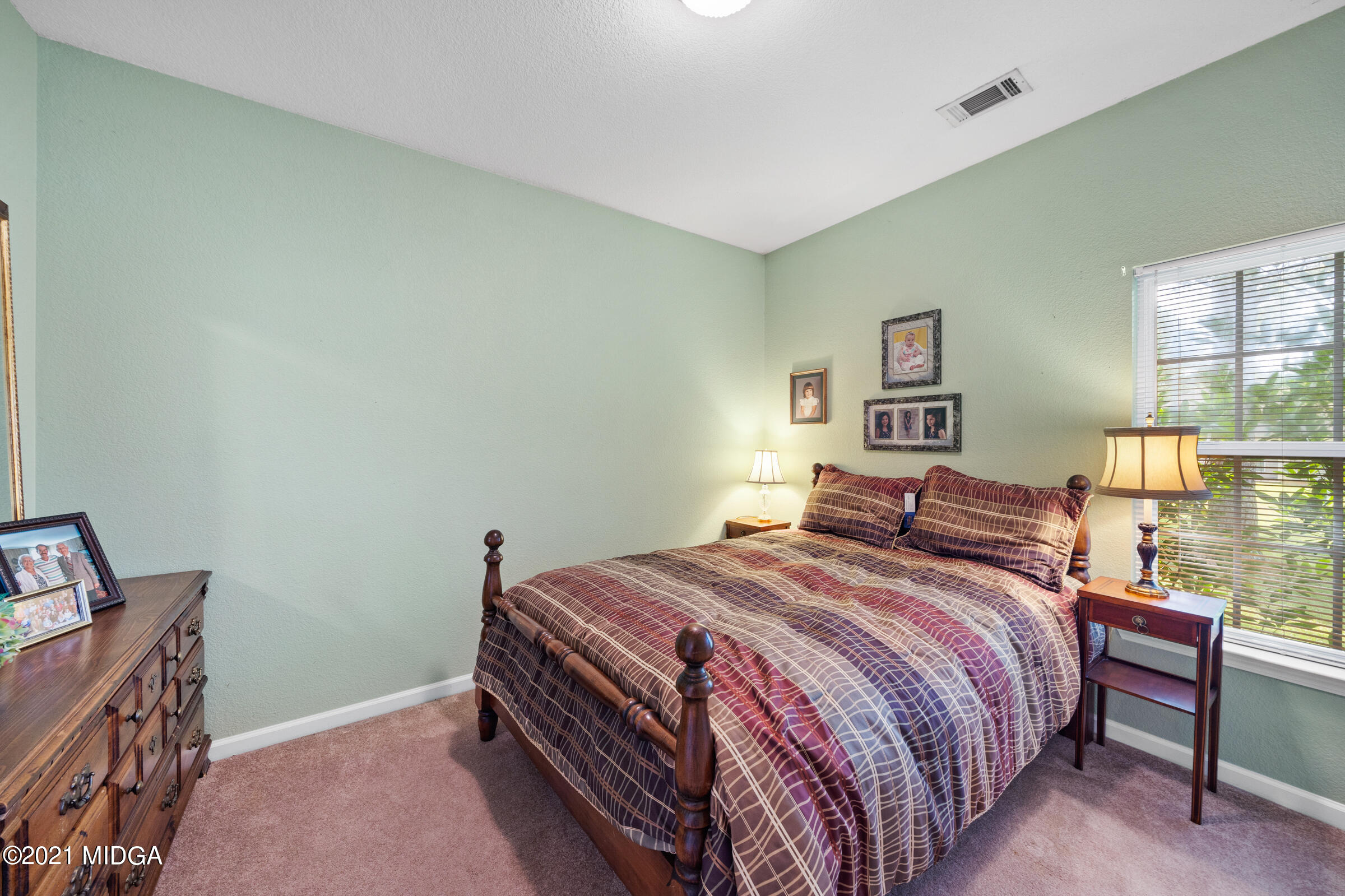 102 Bridgehampton Way Perry, GA 31069 - Photo 15 of 27 a bedroom with a bed and a window