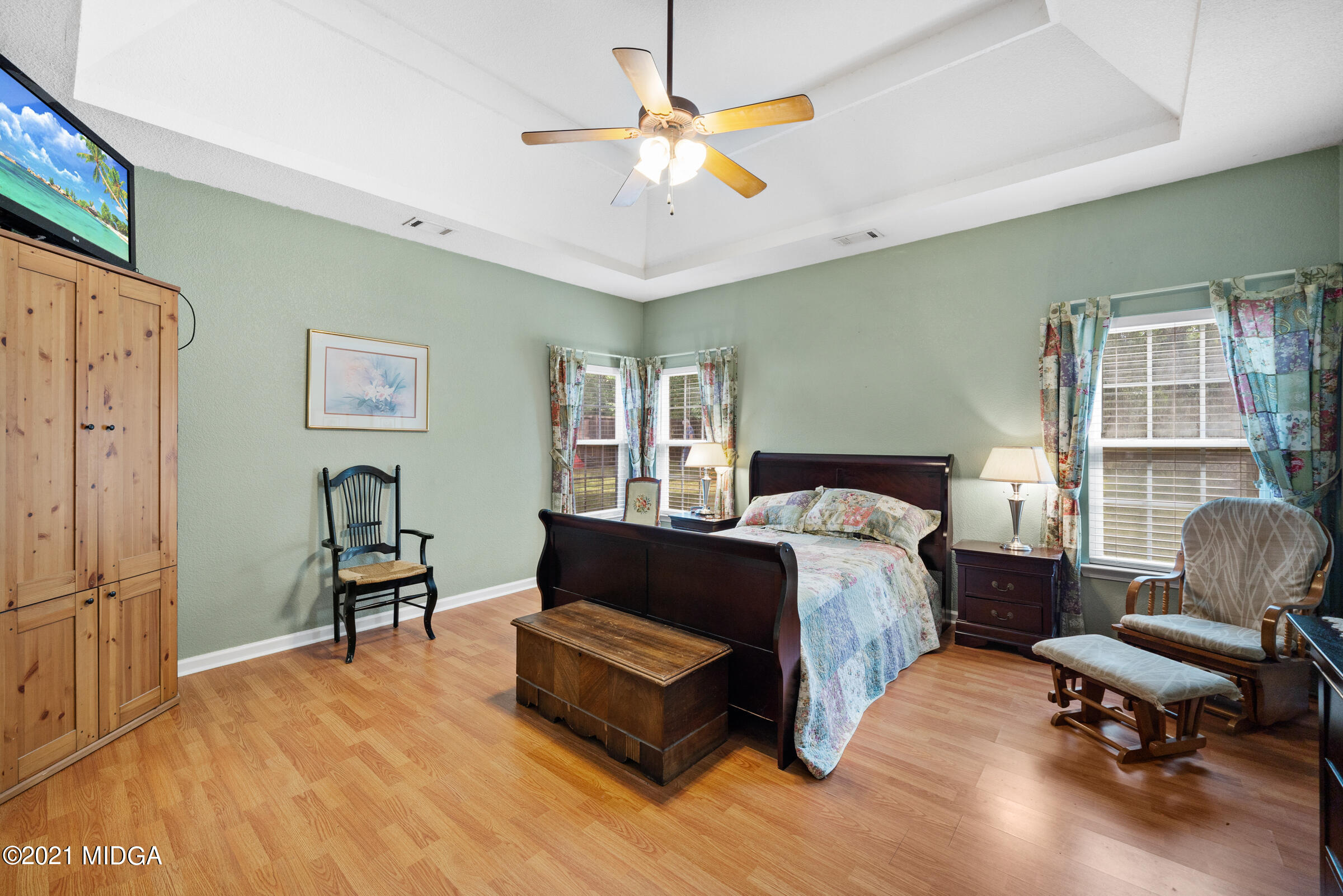 102 Bridgehampton Way Perry, GA 31069 - Photo 17 of 27 a spacious bedroom with a bed and a chair