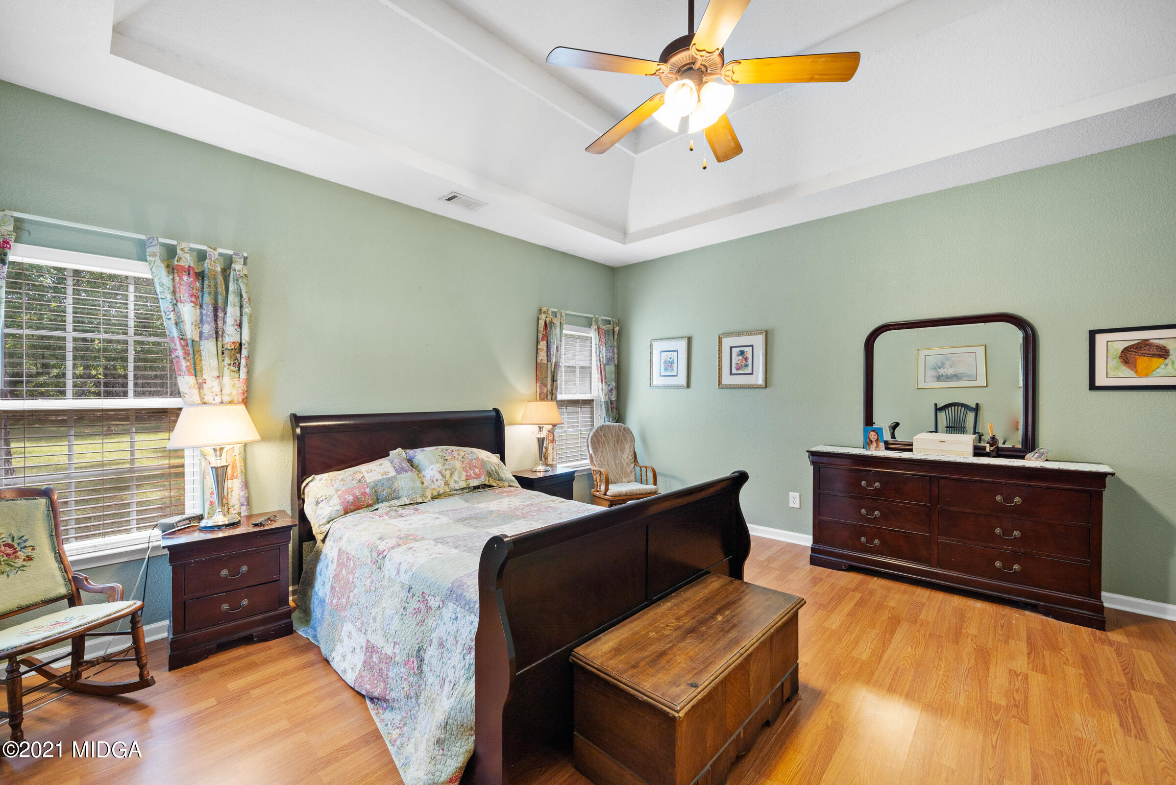 102 Bridgehampton Way Perry, GA 31069 - Photo 18 of 27 a bed room with a bed window and a dresser