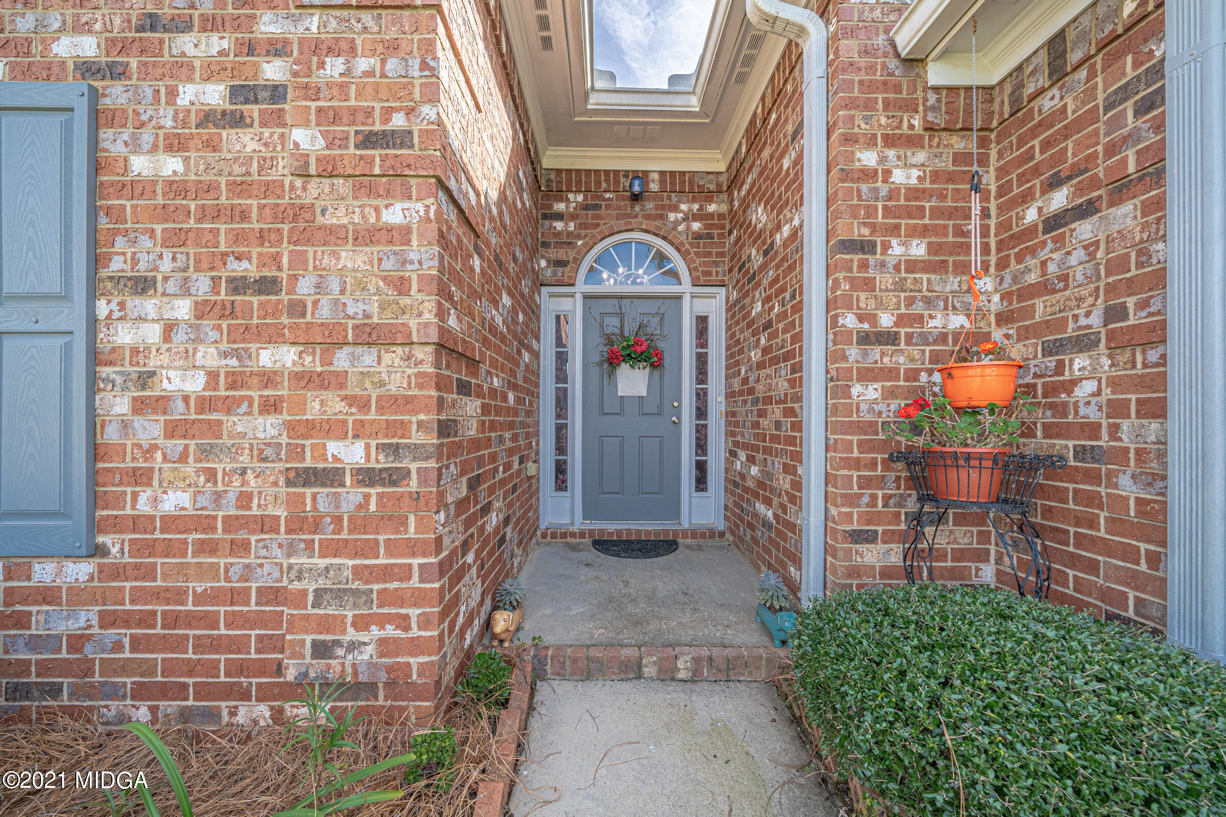 102 Bridgehampton Way Perry, GA 31069 - Photo 3 of 27 a view of a brick buildings with many windows
