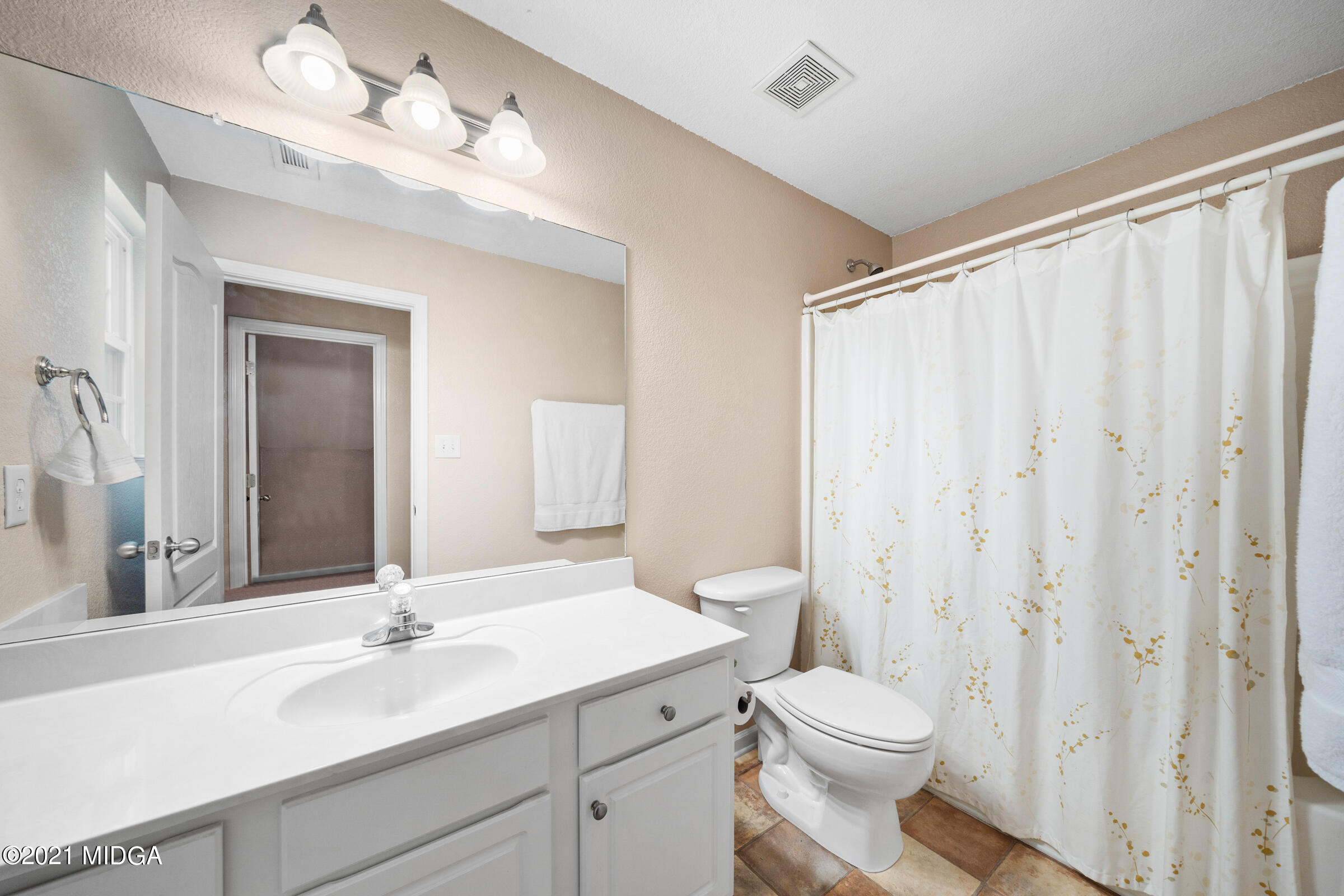 102 Bridgehampton Way Perry, GA 31069 - Photo 22 of 27 a bathroom with a toilet a sink and a mirror