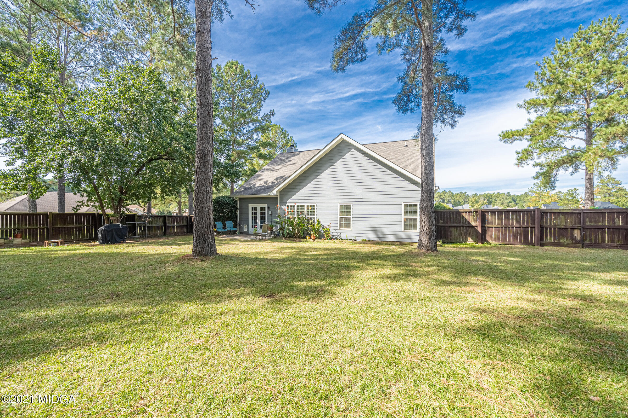102 Bridgehampton Way Perry, GA 31069 - Photo 26 of 27 a view of a house with a yard and a large tree