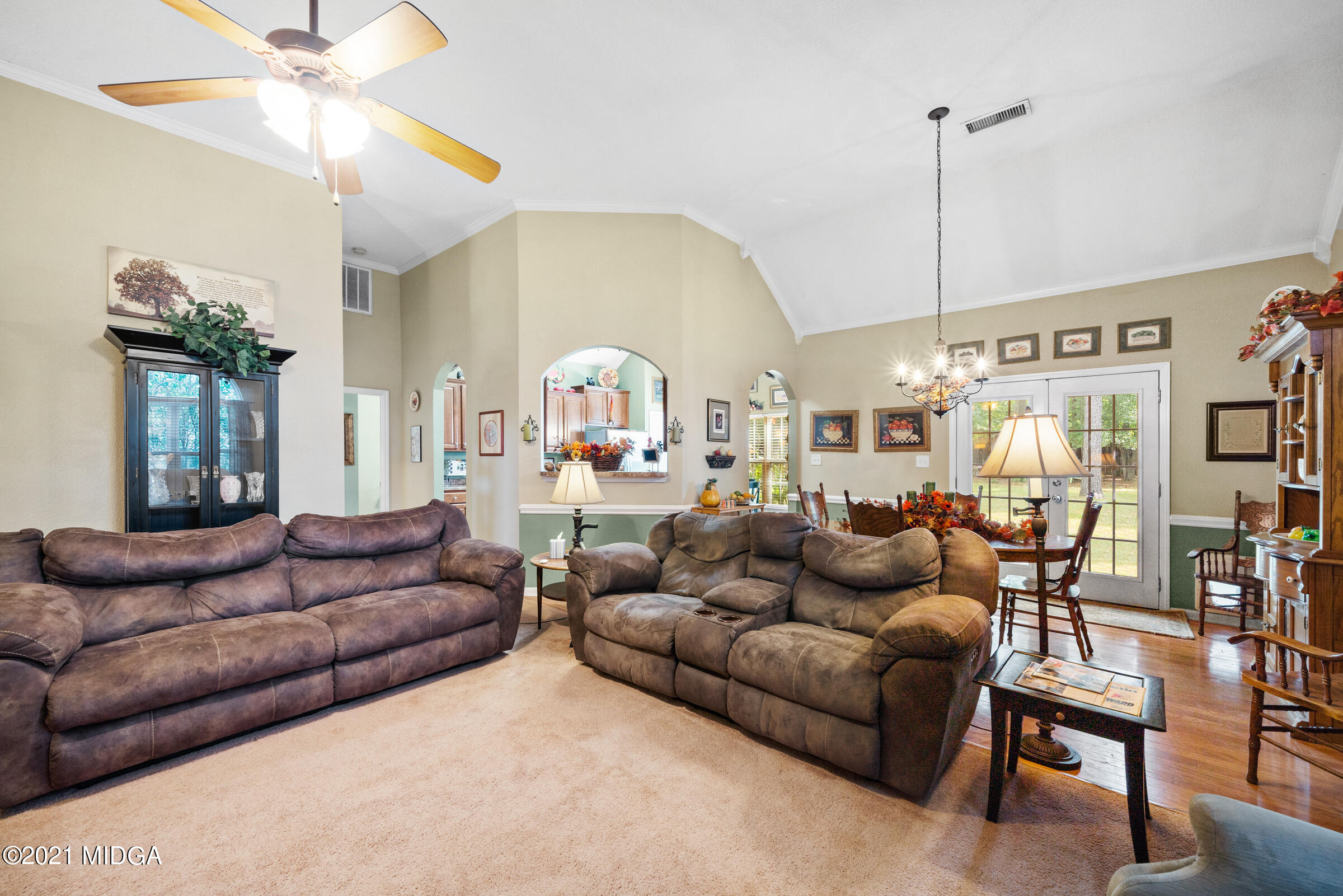 102 Bridgehampton Way Perry, GA 31069 - Photo 9 of 27 a living room with furniture ceiling fan and rug
