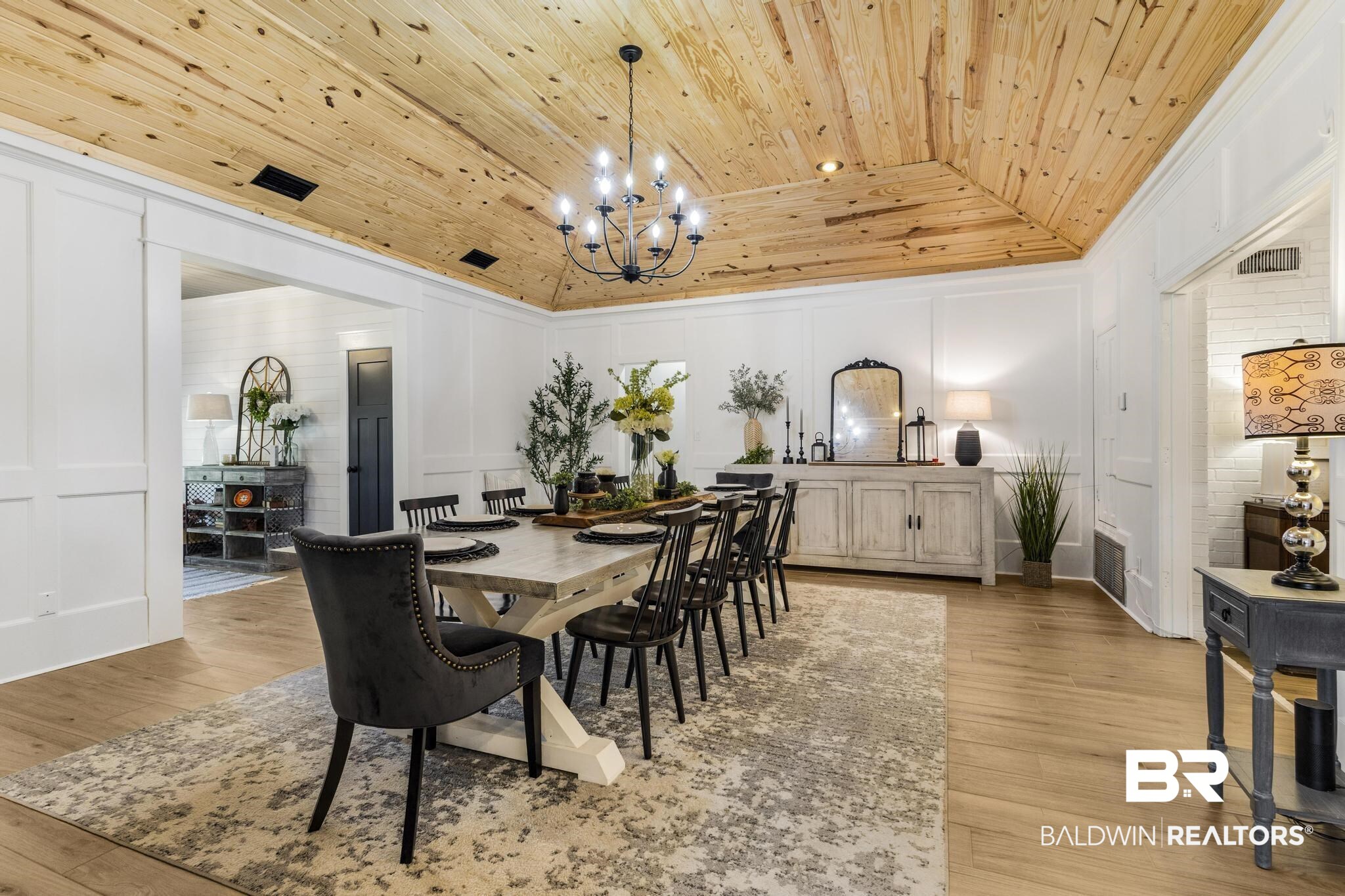83 Caisson Trace Daphne, AL 36527 - Photo 16 of 63 Vaulted wood-plank ceiling with a black chandelier