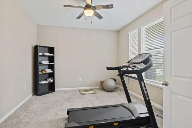 a view of workspace with wooden floor and cabinet