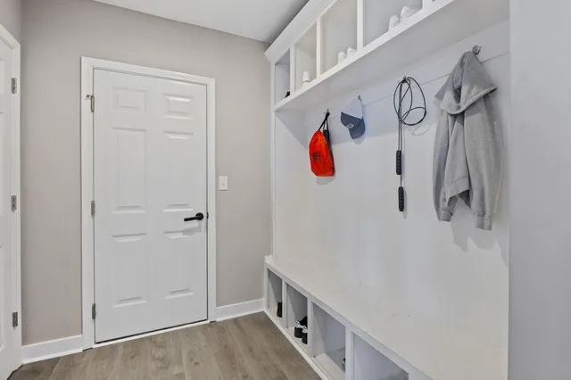 a white toilet sitting next to a bathroom sink