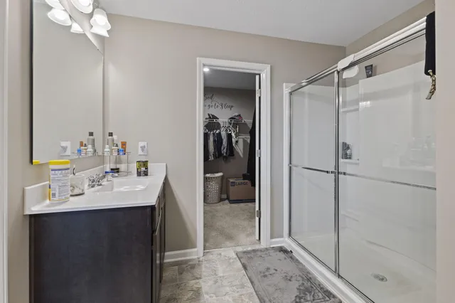 a bathroom with a double vanity sink and mirror