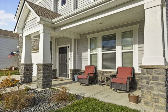 a view of a patio with table and chairs and potted plants
