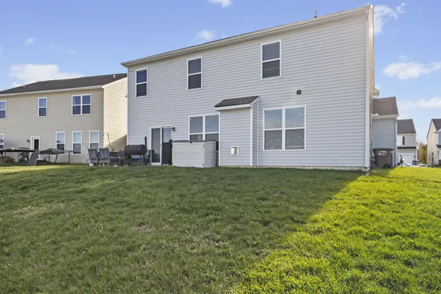 a black white and white photo of a living room