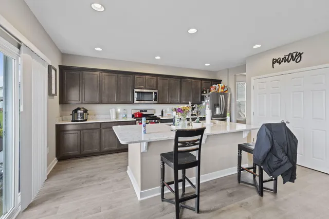 a kitchen with counter top space and appliances