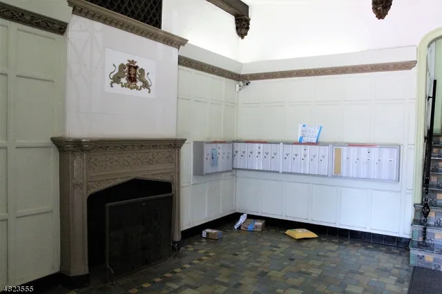 a room with a fireplace and cabinets