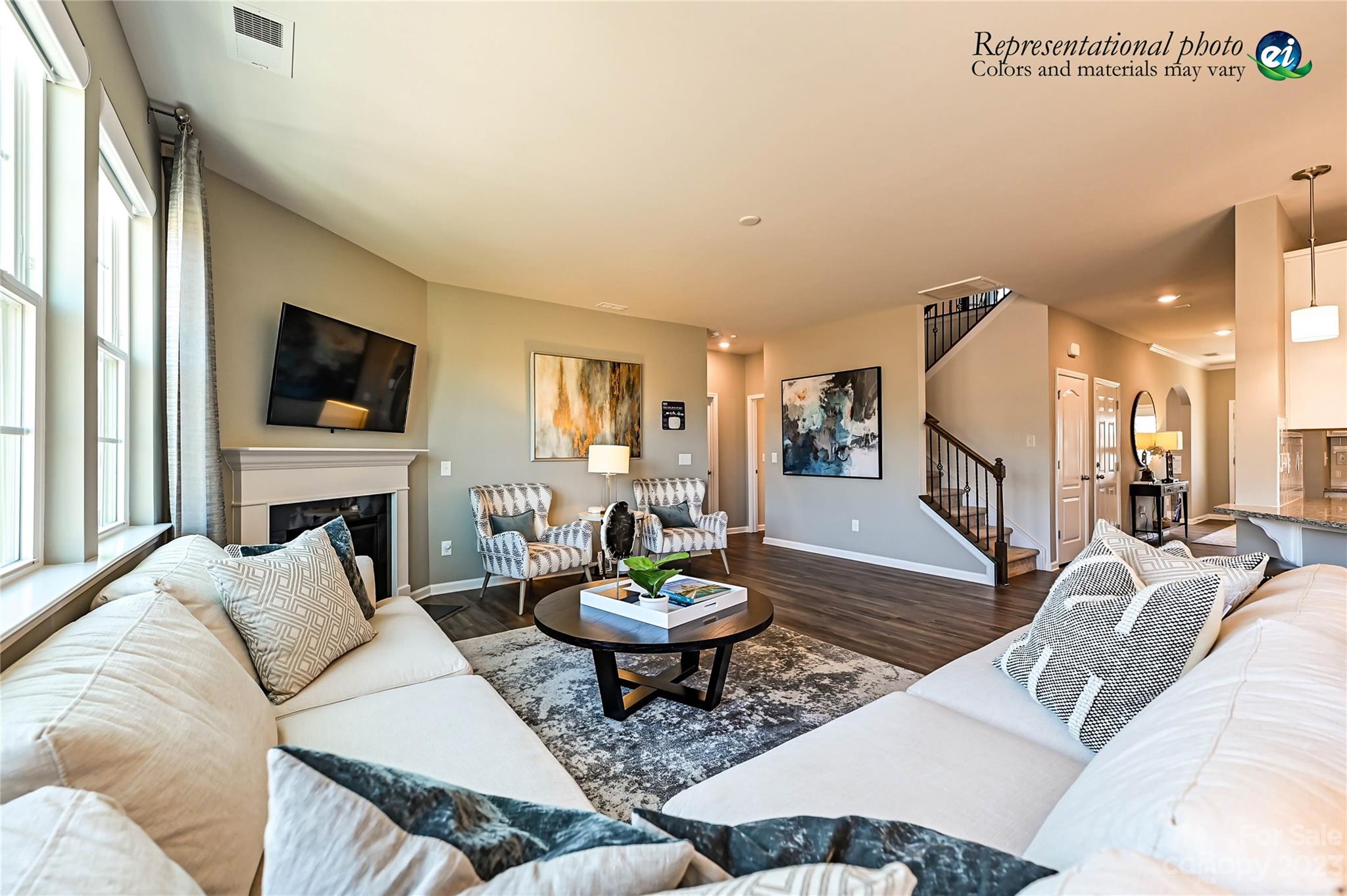 5653 Soft Shell Drive, Unit 376 Lancaster, SC 29720 - Photo 15 of 30 a living room with furniture a fireplace and a flat screen tv