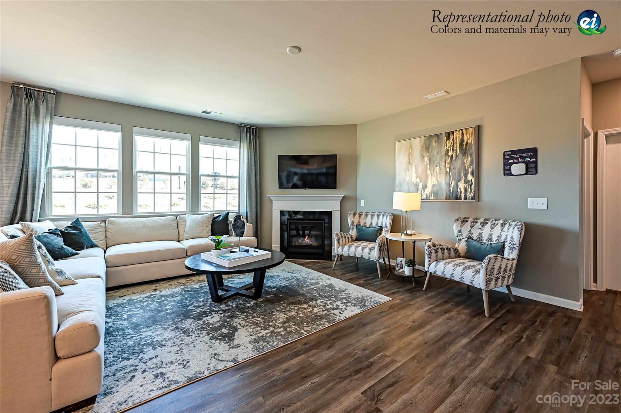 5653 Soft Shell Drive, Unit 376 Lancaster, SC 29720 - Photo 16 of 30 a living room with furniture a fireplace and a large window
