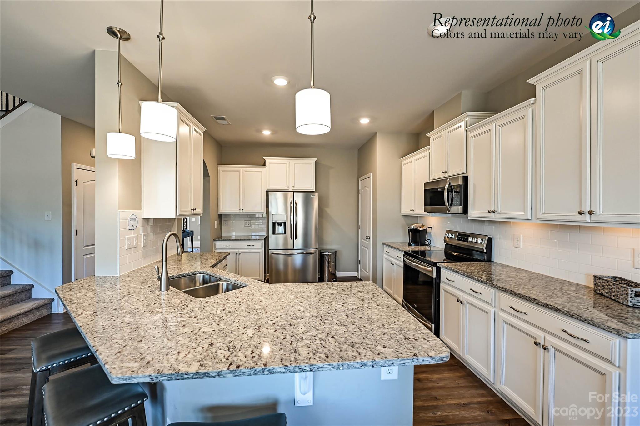 5653 Soft Shell Drive, Unit 376 Lancaster, SC 29720 - Photo 8 of 30 a kitchen with stainless steel appliances granite countertop a sink refrigerator and cabinets