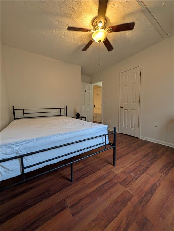 355 Shannon Way Lawrenceville, GA 30044 - Photo 18 of 42 a bedroom with furniture and wooden floor