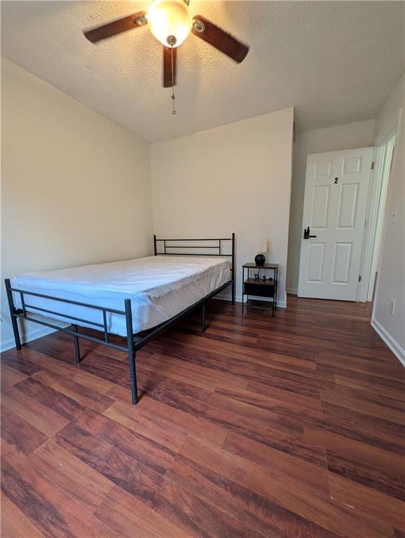 355 Shannon Way Lawrenceville, GA 30044 - Photo 19 of 42 a room with wooden floor and furniture