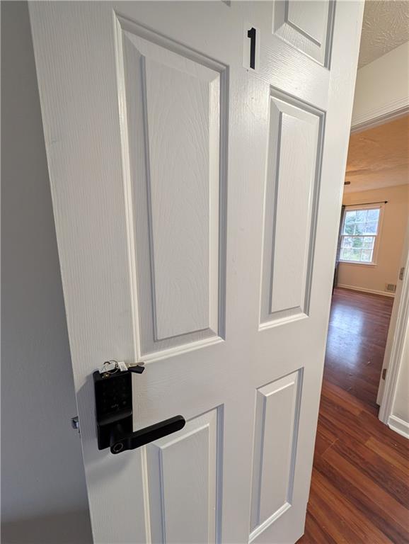 355 Shannon Way Lawrenceville, GA 30044 - Photo 22 of 42 a view of hallway with wooden floor