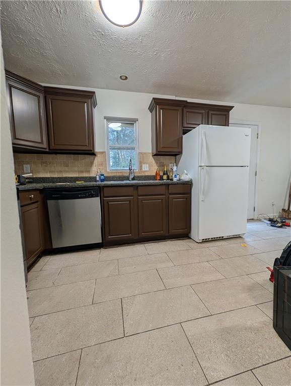 355 Shannon Way Lawrenceville, GA 30044 - Photo 25 of 42 a kitchen with stainless steel appliances granite countertop a stove a sink and a refrigerator
