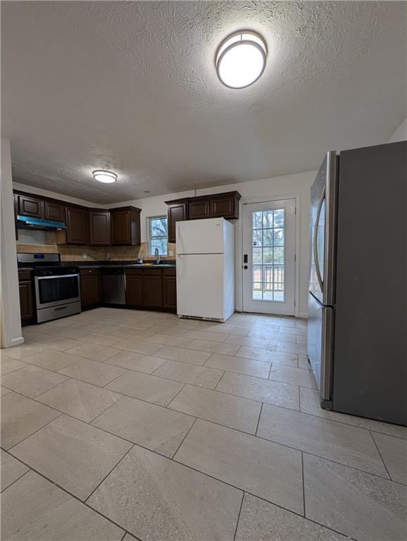 355 Shannon Way Lawrenceville, GA 30044 - Photo 31 of 42 a kitchen with a cabinets and refrigerator