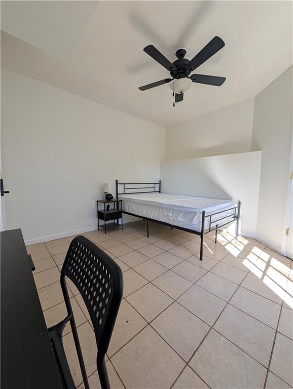355 Shannon Way Lawrenceville, GA 30044 - Photo 41 of 42 a living room with a bed furniture and a window