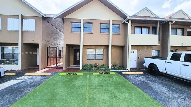 a picture of a room with a white wall and a picture