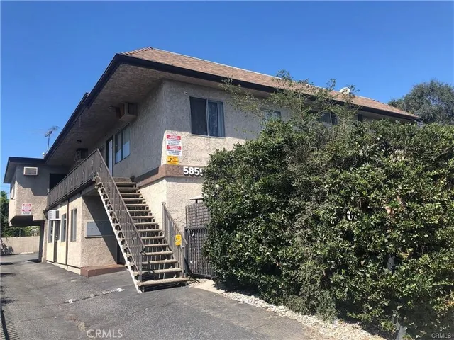 a kitchen with a stove a refrigerator and a sink