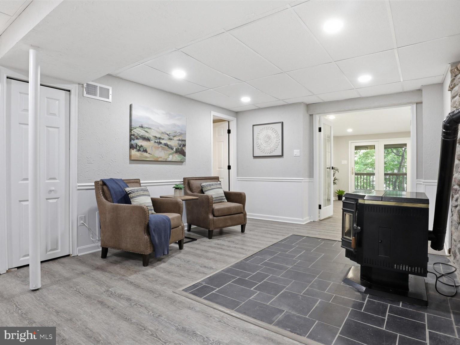 8061 Athena Street Springfield, VA 22153 - Photo 28 of 48 Cozy sitting area around pellet stove