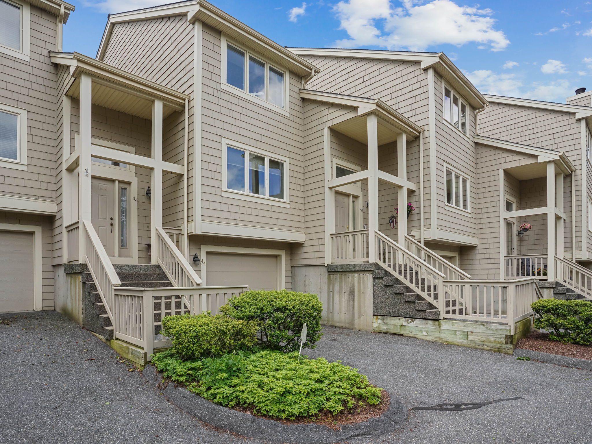 front view of a house with a street