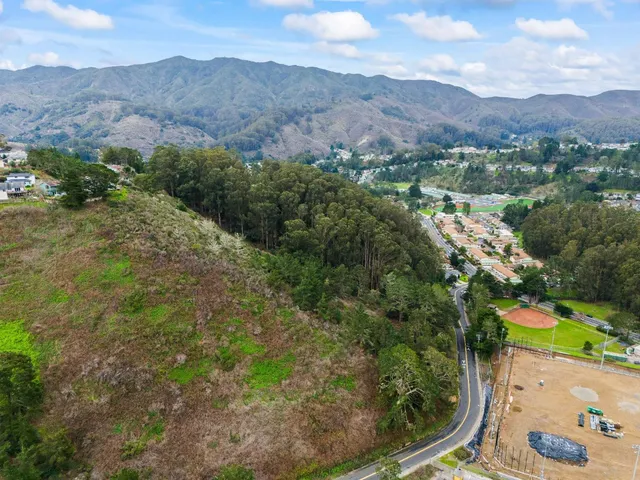 an aerial view of residential house and outdoor space