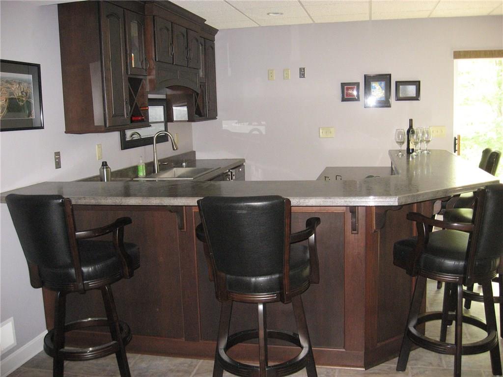 7 Sugar Run Road Eighty Four, PA 15330 - Photo 20 of 25 Custom Bar with dishwasher and refrigerator, double doors lead to lower patio.