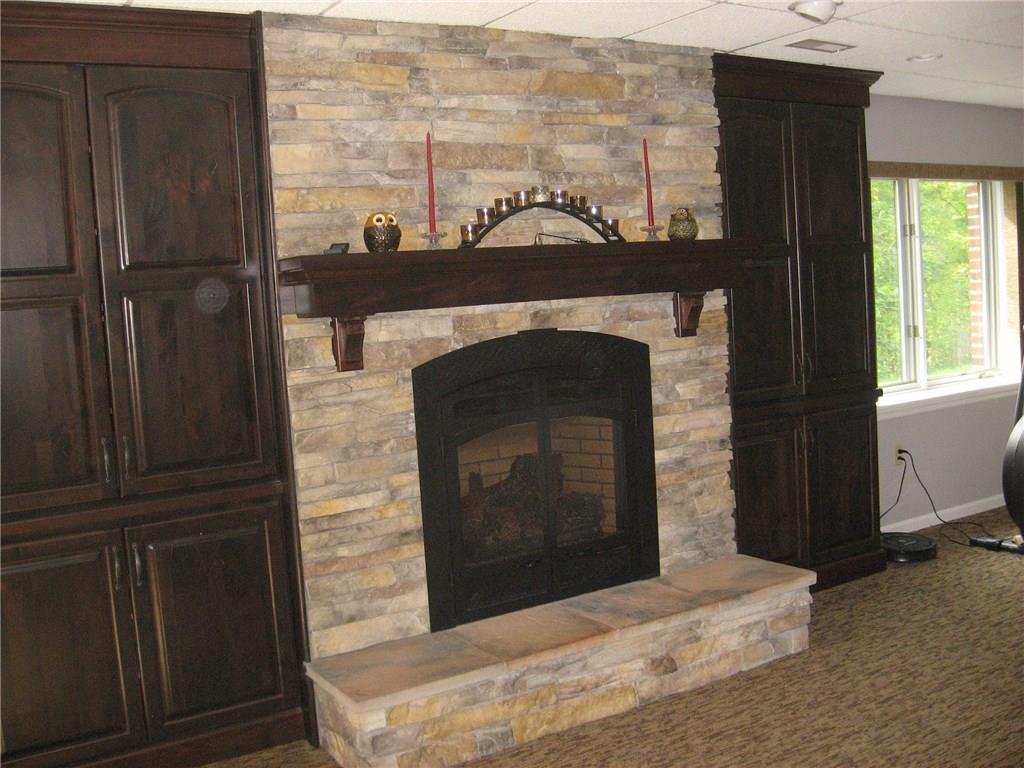7 Sugar Run Road Eighty Four, PA 15330 - Photo 21 of 25 Beautiful stone gas fireplace with custom cabinets.