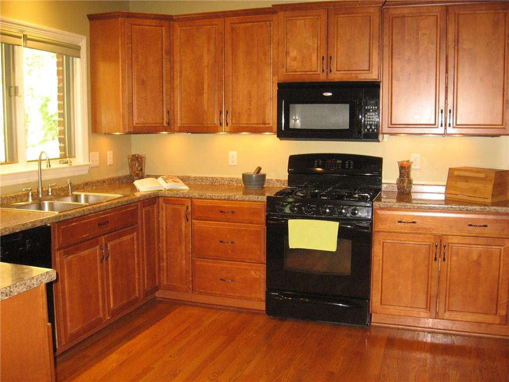 7 Sugar Run Road Eighty Four, PA 15330 - Photo 7 of 25 Kitchen has custom cabinetry, with plenty of counter space, storage, gas stove and miele dishwasher.