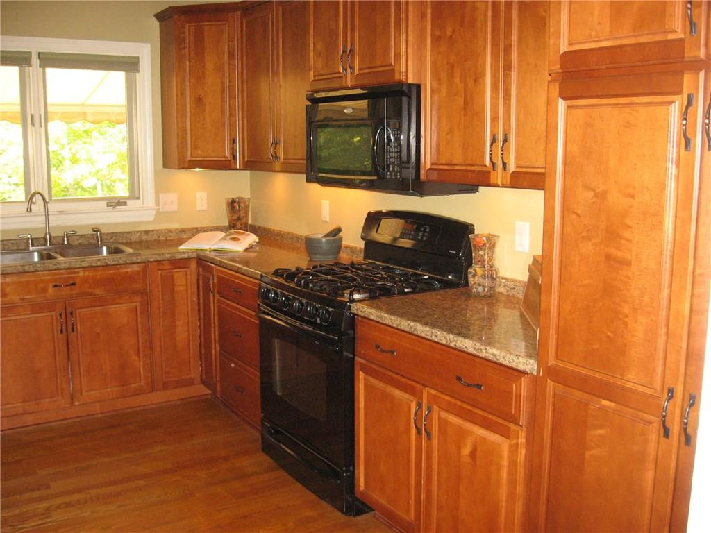 7 Sugar Run Road Eighty Four, PA 15330 - Photo 8 of 25 Hardwood floors flow from great room into the kitchen area. Accent lighting under cabinets.