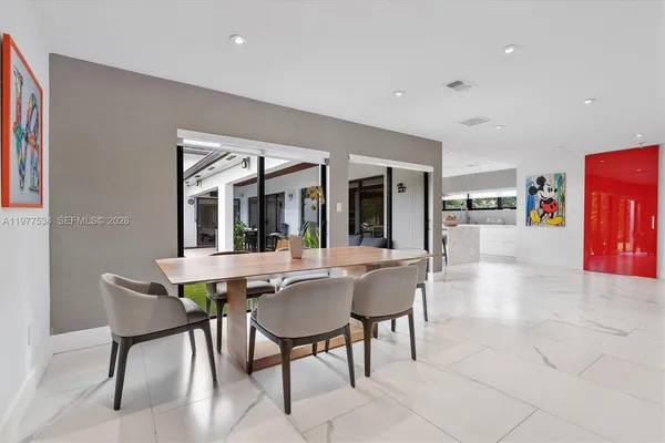 a view of a dining room with furniture