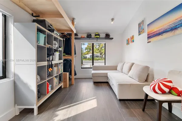 a living room with furniture and a window