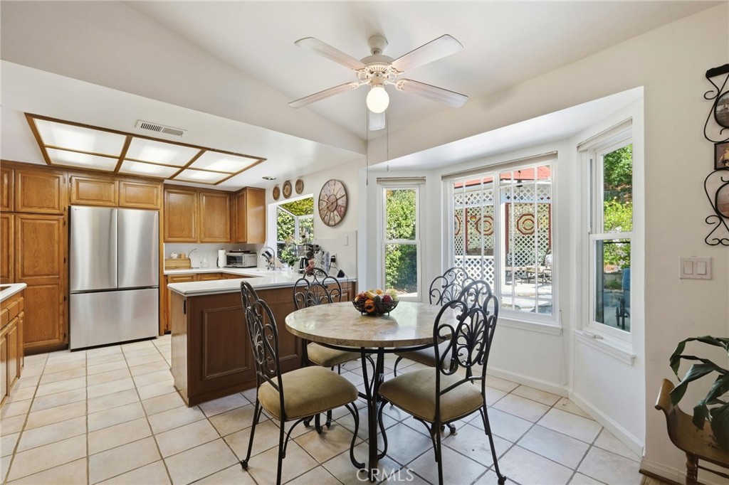 18233 Charlton Lane Porter Ranch, CA 91326 - Photo 38 of 40 a dining room with furniture and window