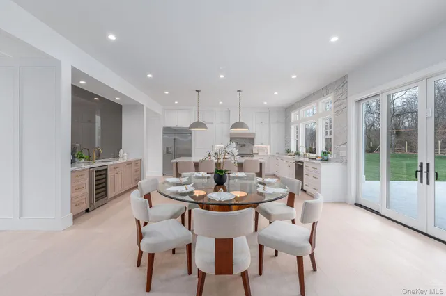 a large kitchen with stainless steel appliances and a large cabinets