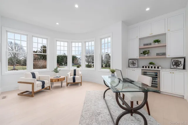 a living room with fireplace furniture and a flat screen tv