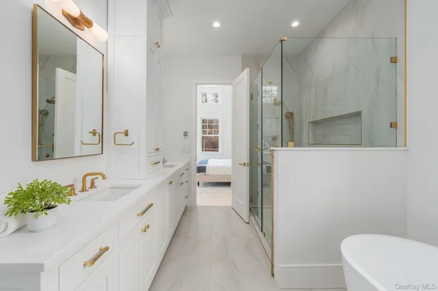 a spacious bedroom with a bed and a couch