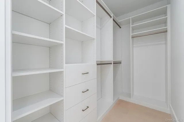 a bathroom with a double vanity sink toilet and shower